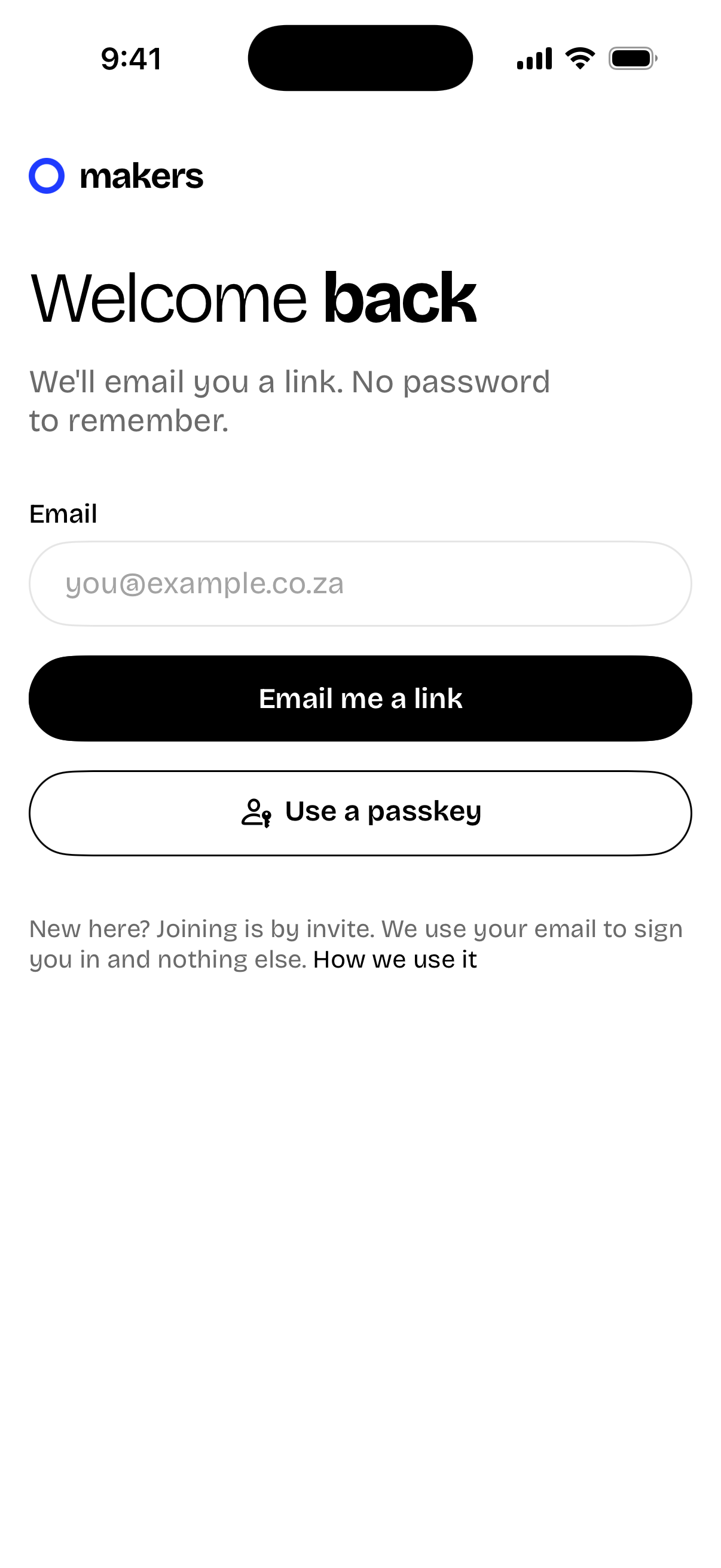 A sign-in screen with an email pill field, a black pill and an outlined passkey pill